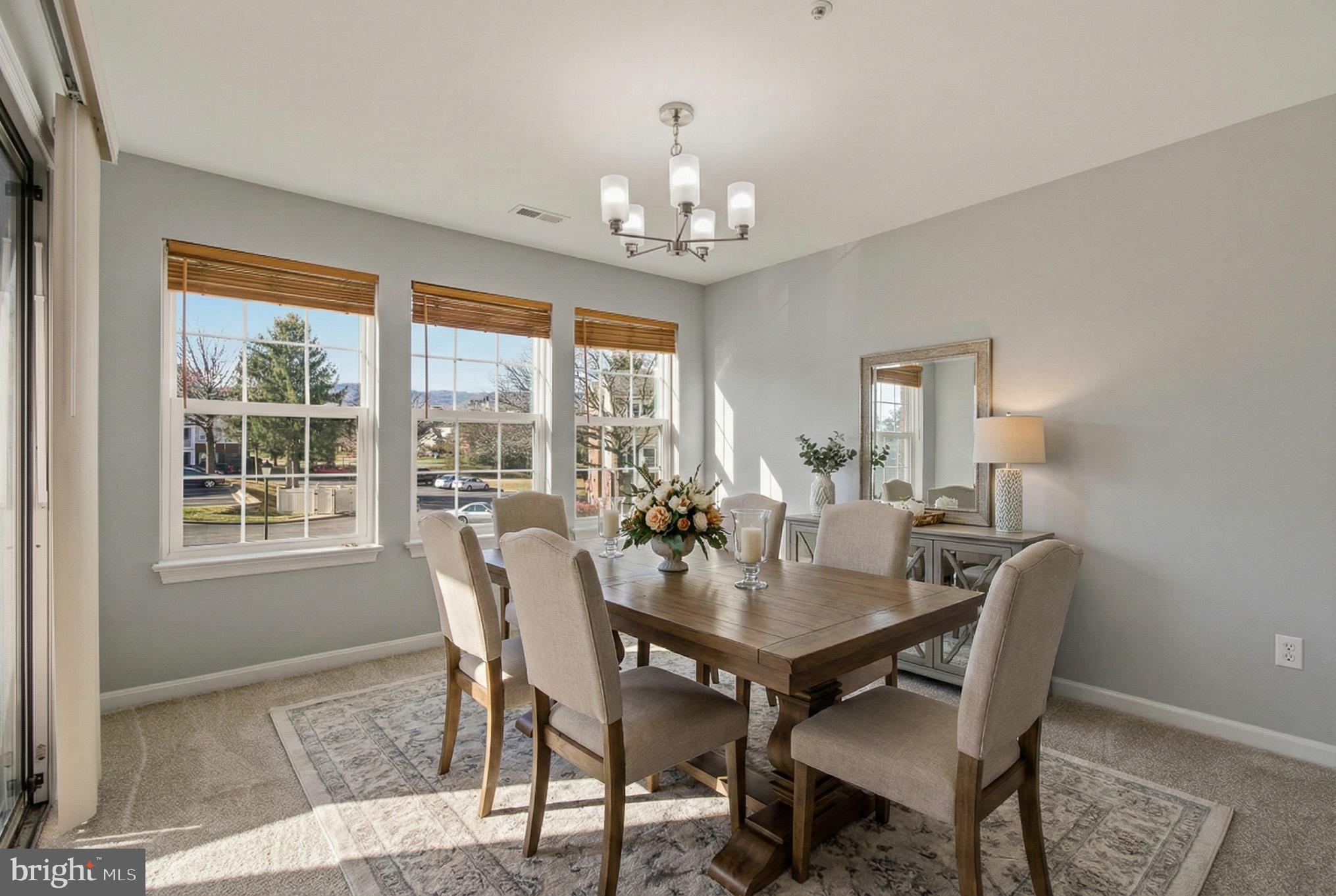2400 Ellsworth Way, Unit 2D Frederick, MD 21702 - Photo 13 of 34 a view of a dining room with furniture window and outside view