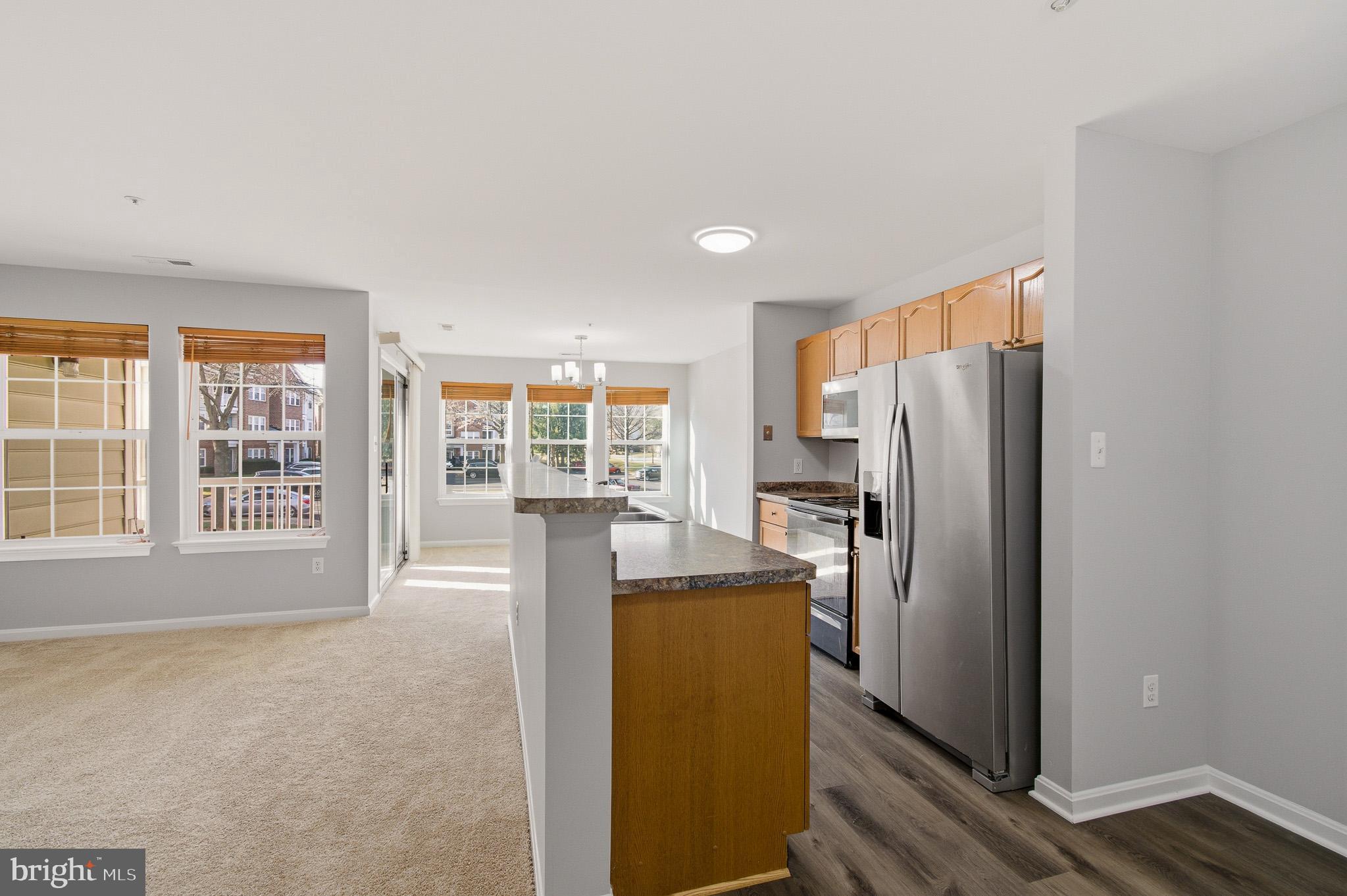 2400 Ellsworth Way, Unit 2D Frederick, MD 21702 - Photo 24 of 34 a view of a kitchen with refrigerator and a dishwasher