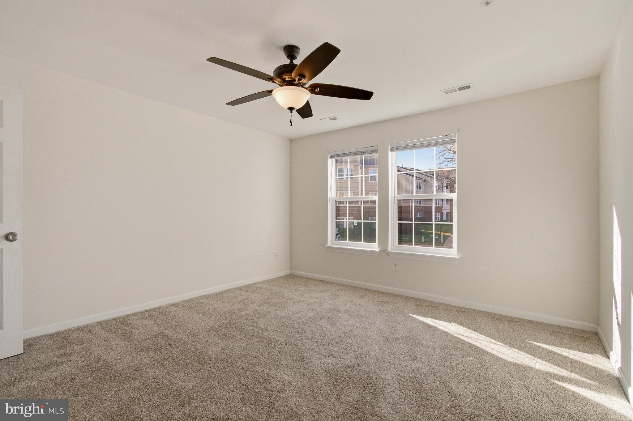 2400 Ellsworth Way, Unit 2D Frederick, MD 21702 - Photo 26 of 34 a view of an empty room with a window