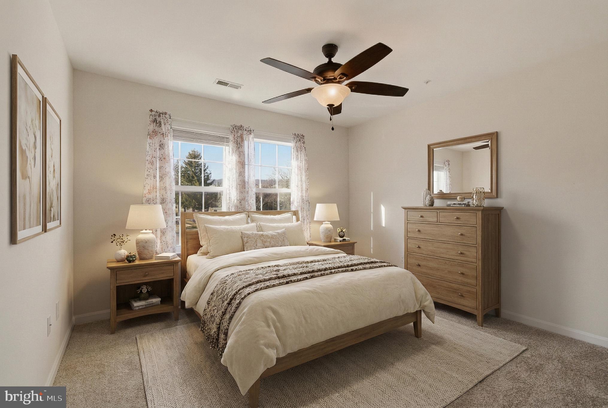 2400 Ellsworth Way, Unit 2D Frederick, MD 21702 - Photo 27 of 34 a bedroom with a bed a chandelier and a window