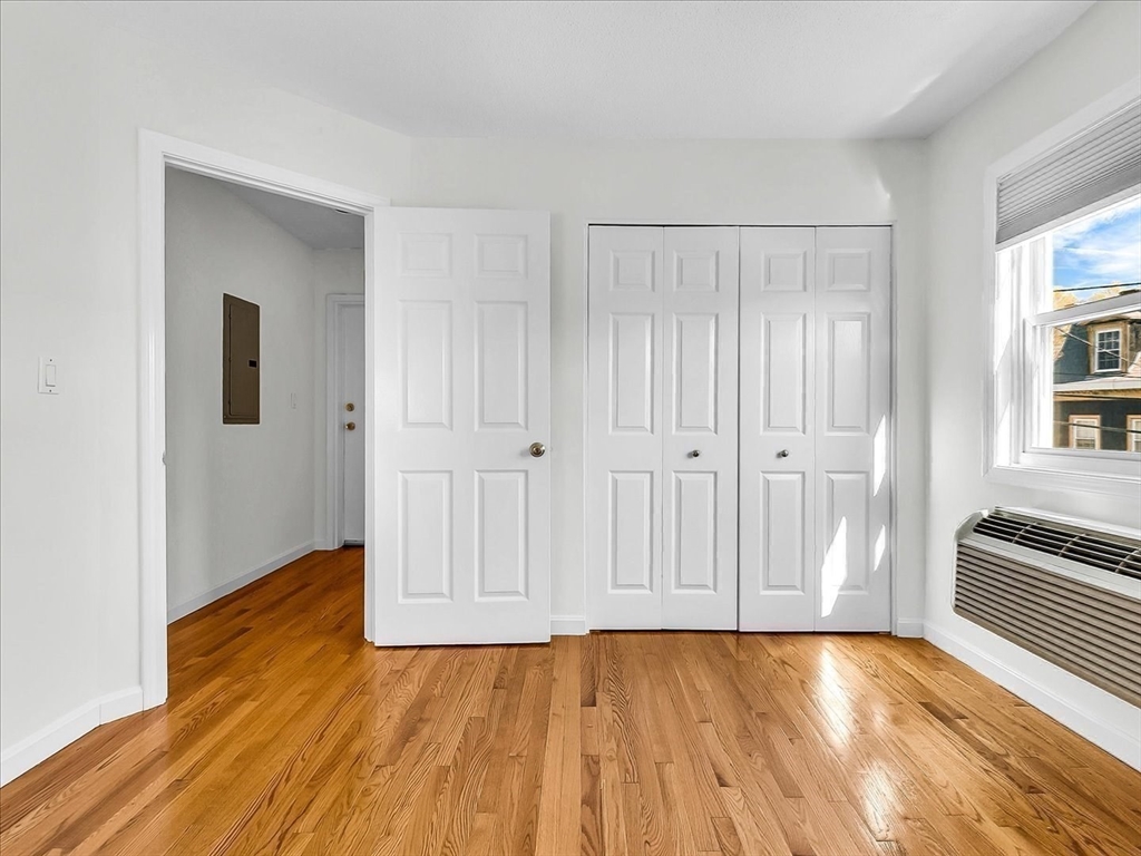 115 Water Street, Unit 14 Beverly, MA 01915 - Photo 21 of 38 a view of an empty room with wooden floor