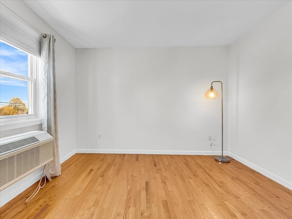 115 Water Street, Unit 14 Beverly, MA 01915 - Photo 22 of 38 a view of room with wooden floor and window