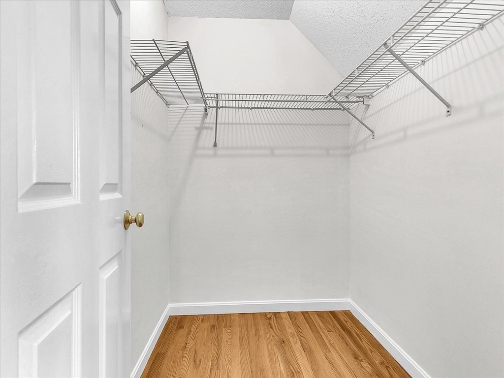 115 Water Street, Unit 14 Beverly, MA 01915 - Photo 24 of 38 a view of a room with racks on the wall