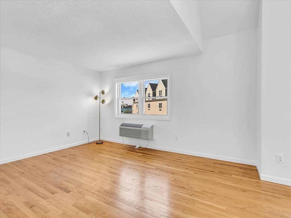 115 Water Street, Unit 14 Beverly, MA 01915 - Photo 28 of 38 a view of a room with a wooden floor