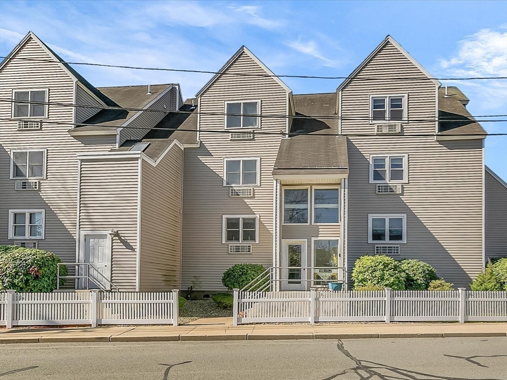 115 Water Street, Unit 14 Beverly, MA 01915 - Photo 32 of 38 front view of a house with a small yard