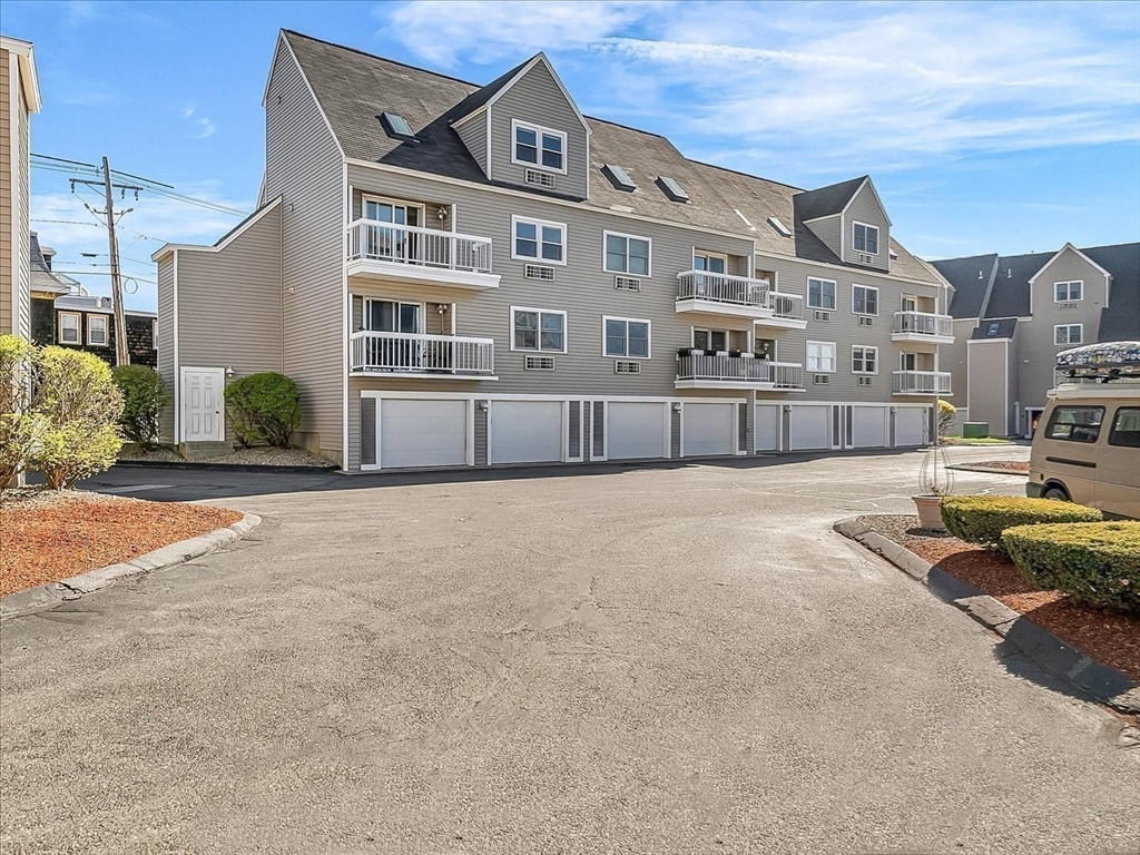 115 Water Street, Unit 14 Beverly, MA 01915 - Photo 33 of 38 a front view of a building with balcony