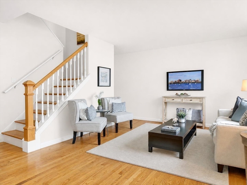 115 Water Street, Unit 14 Beverly, MA 01915 - Photo 6 of 38 a living room with furniture and a table