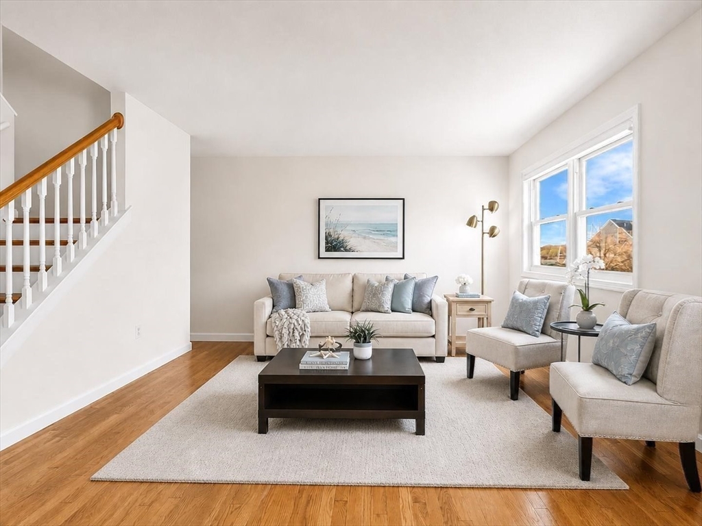 115 Water Street, Unit 14 Beverly, MA 01915 - Photo 8 of 38 a living room with furniture rug and window