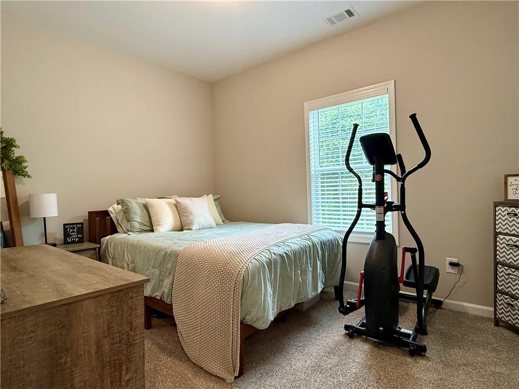 1776 Pleasant Grove Road Temple, GA 30179 - Photo 27 of 45 a bedroom with bed and a mirror