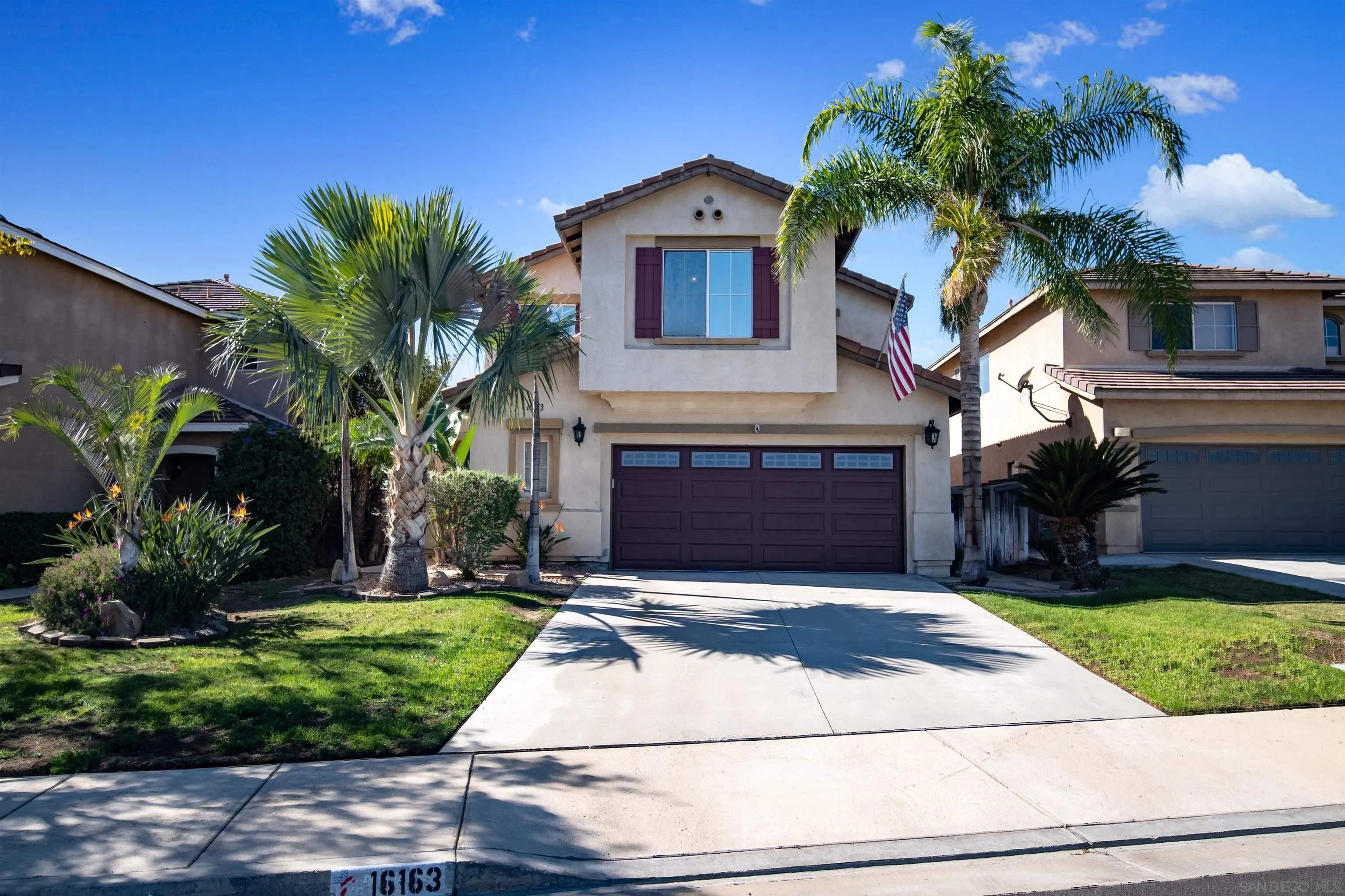 16163 Setting Sun Circle Riverside, CA 92503 - Photo 1 of 45 a front view of a house with a yard and garage