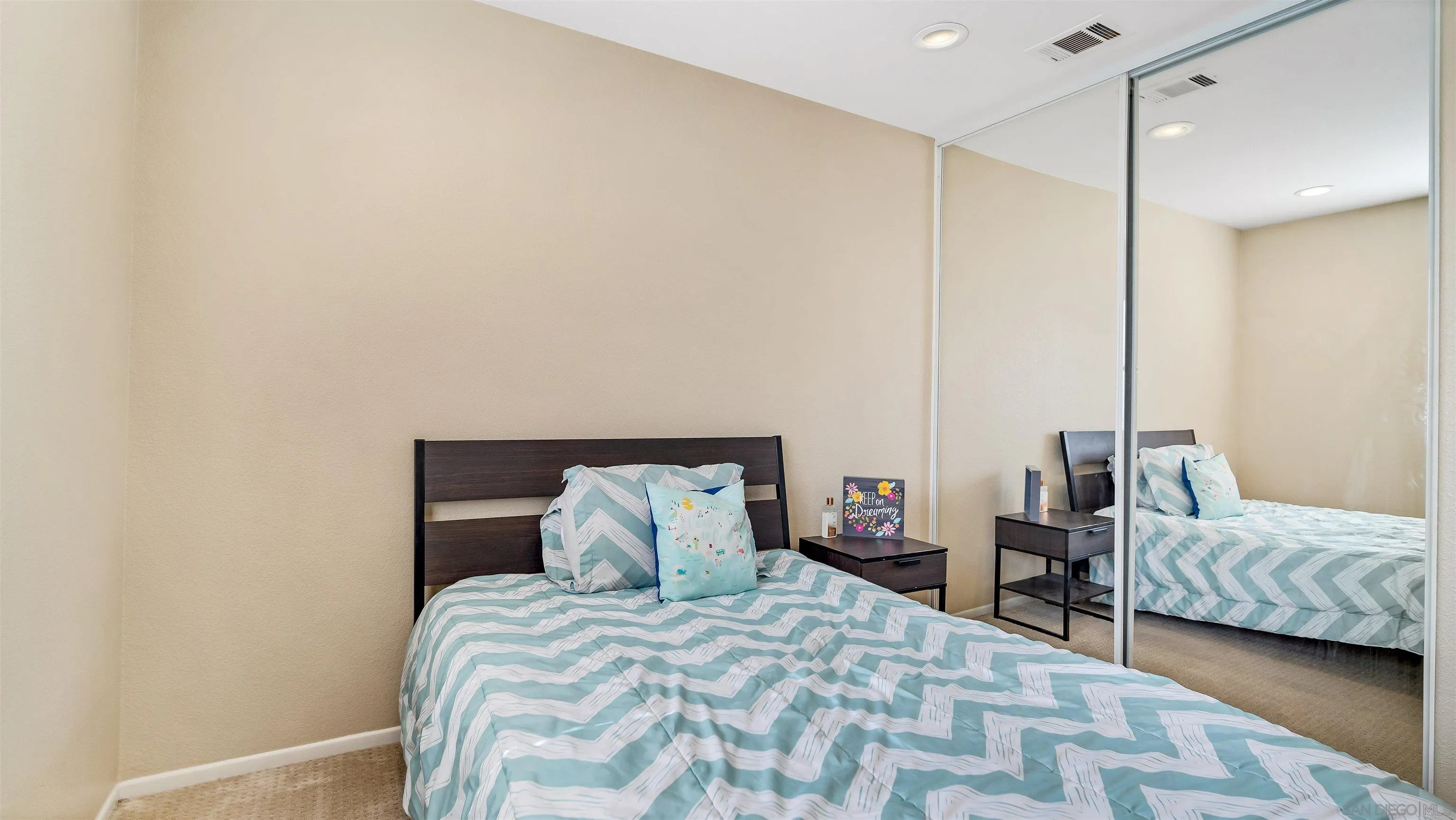 16163 Setting Sun Circle Riverside, CA 92503 - Photo 20 of 45 a bedroom with a bed a window and a couch