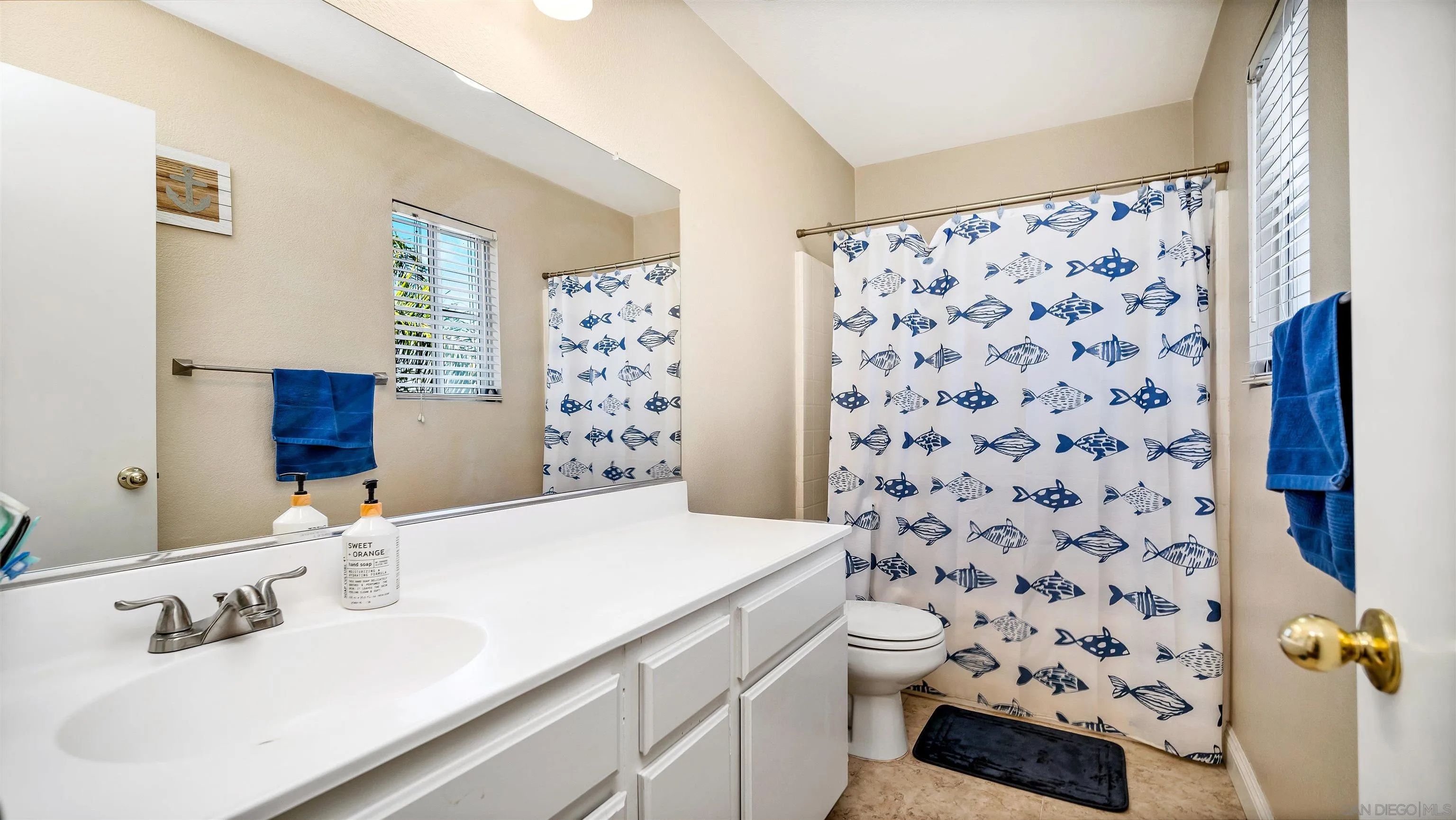 16163 Setting Sun Circle Riverside, CA 92503 - Photo 25 of 45 a bathroom with a sink toilet and shower