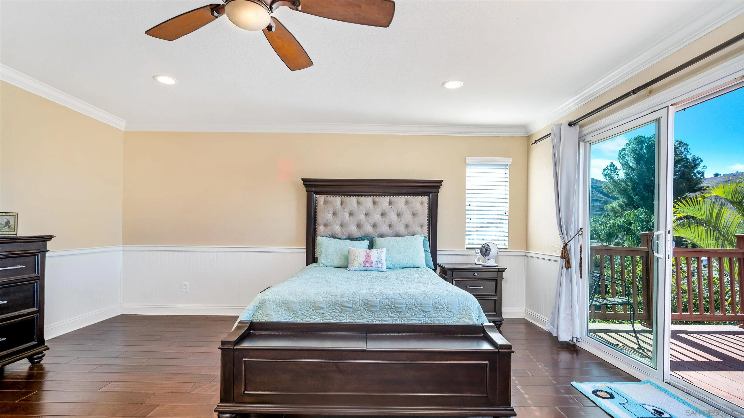 16163 Setting Sun Circle Riverside, CA 92503 - Photo 28 of 45 a bedroom with a large bed and a large window