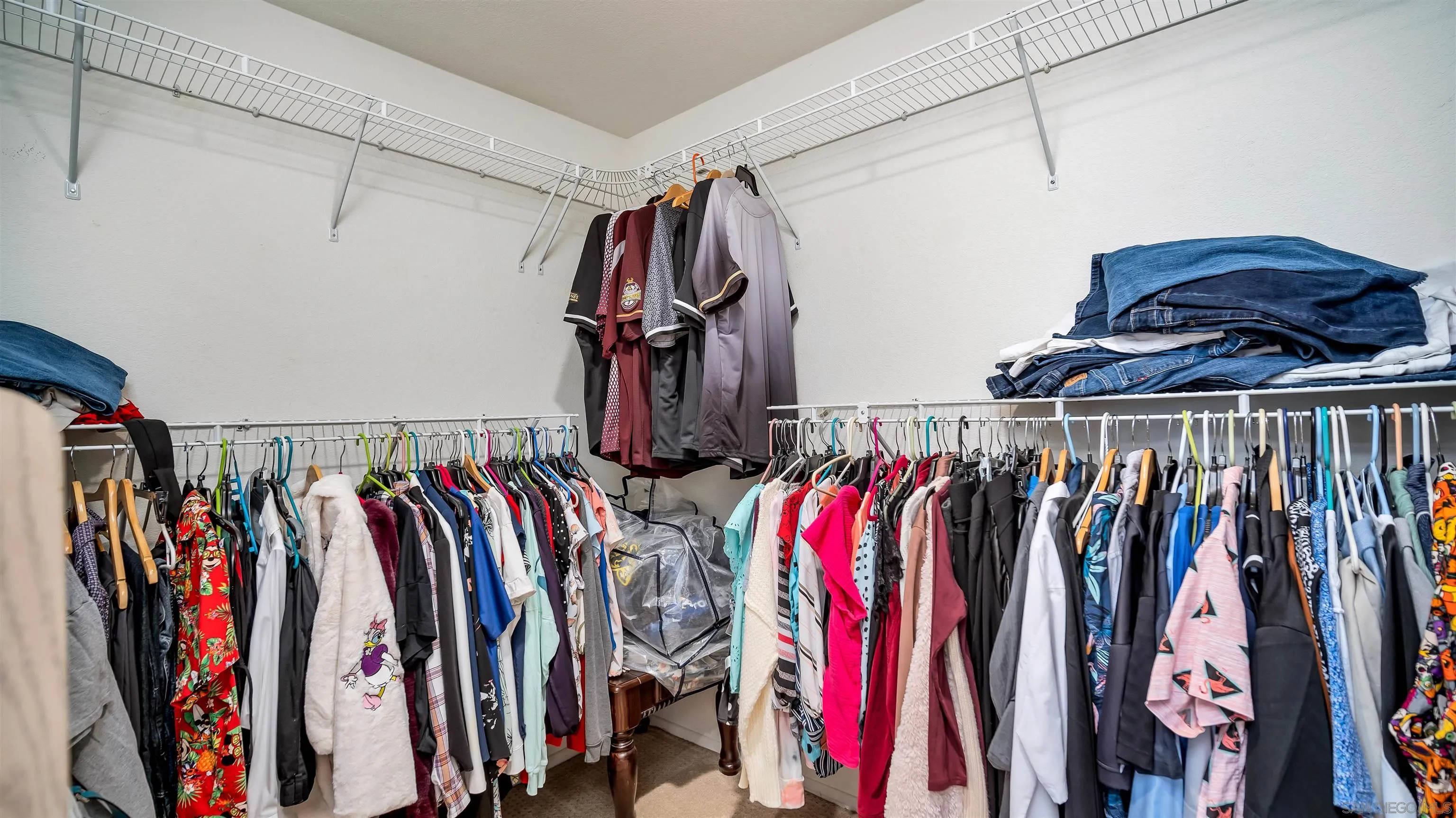 16163 Setting Sun Circle Riverside, CA 92503 - Photo 34 of 45 a view of walk in closet with clothes