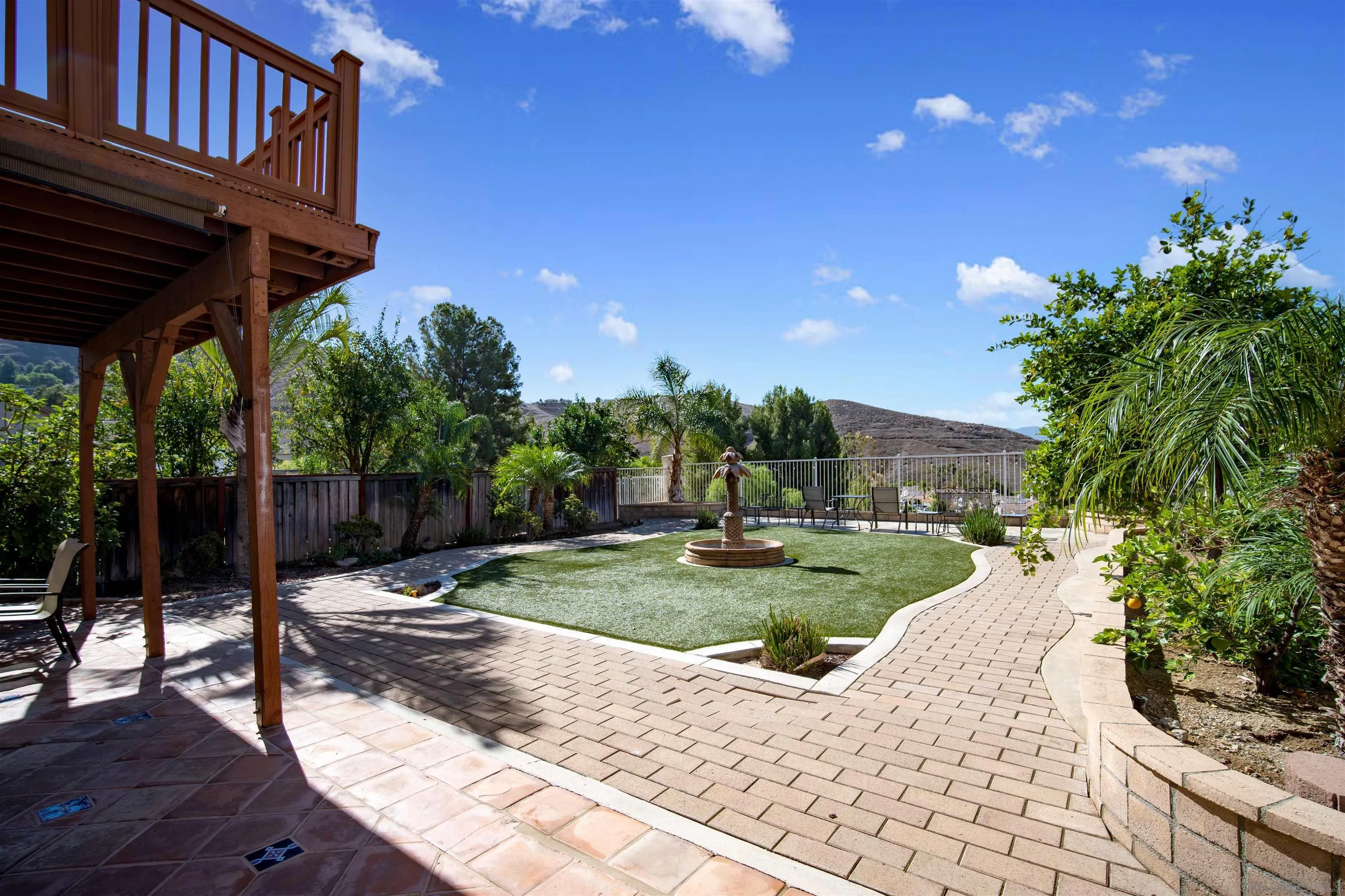 16163 Setting Sun Circle Riverside, CA 92503 - Photo 38 of 45 a view of a porch with furniture and a yard
