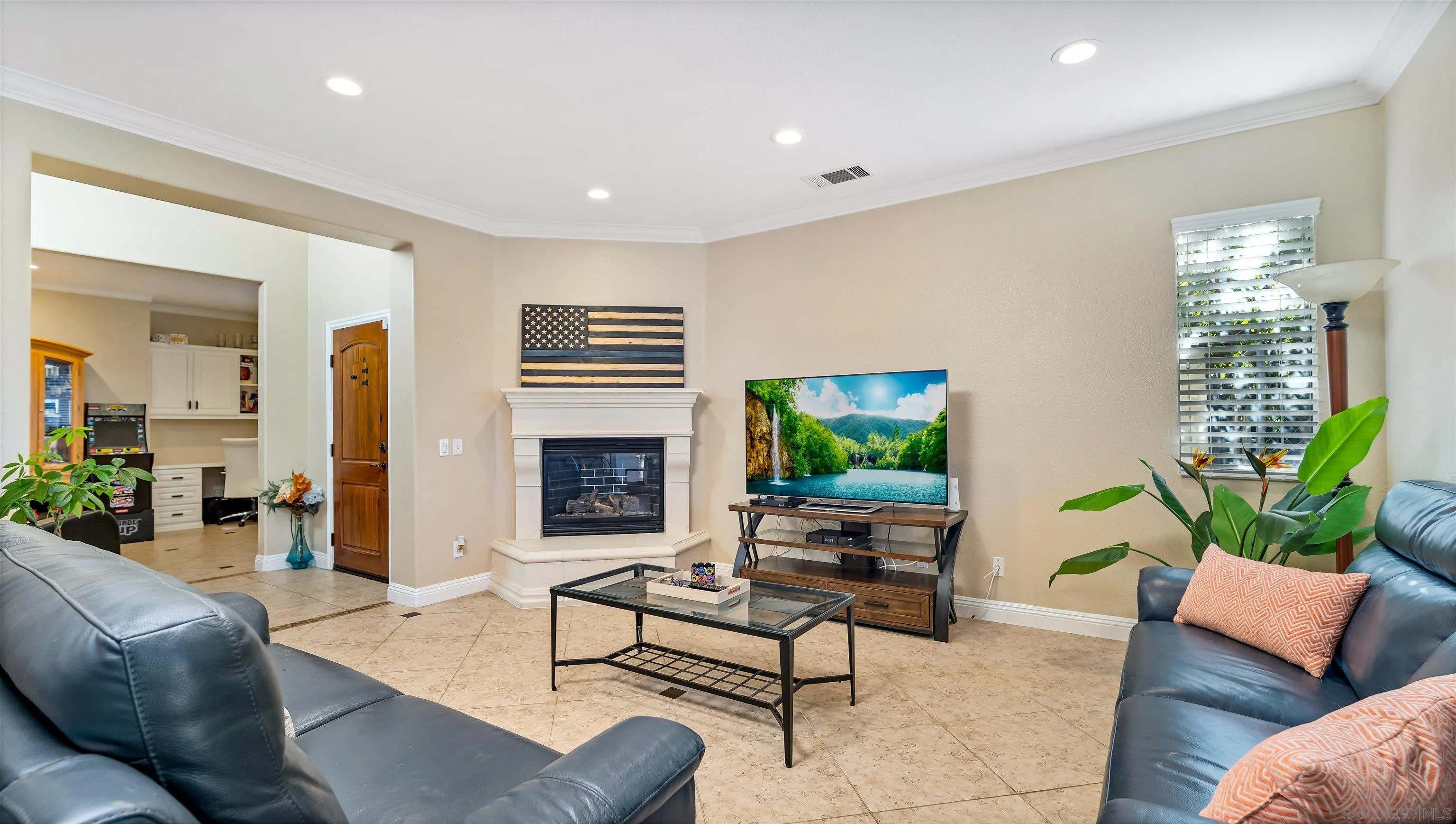 16163 Setting Sun Circle Riverside, CA 92503 - Photo 5 of 45 a living room with furniture a lamp and a fireplace