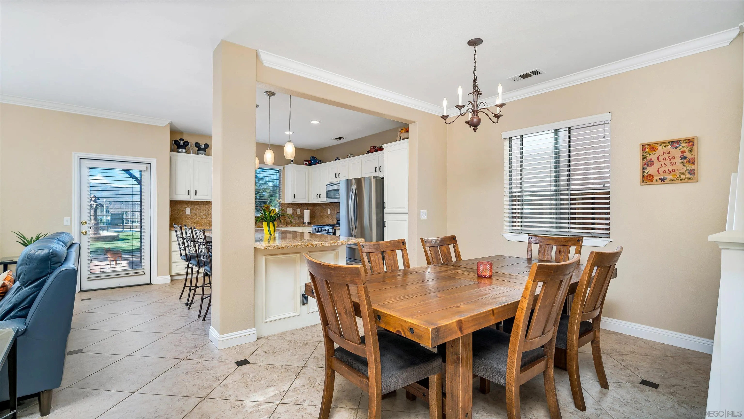 16163 Setting Sun Circle Riverside, CA 92503 - Photo 8 of 45 a dining room with furniture chandelier