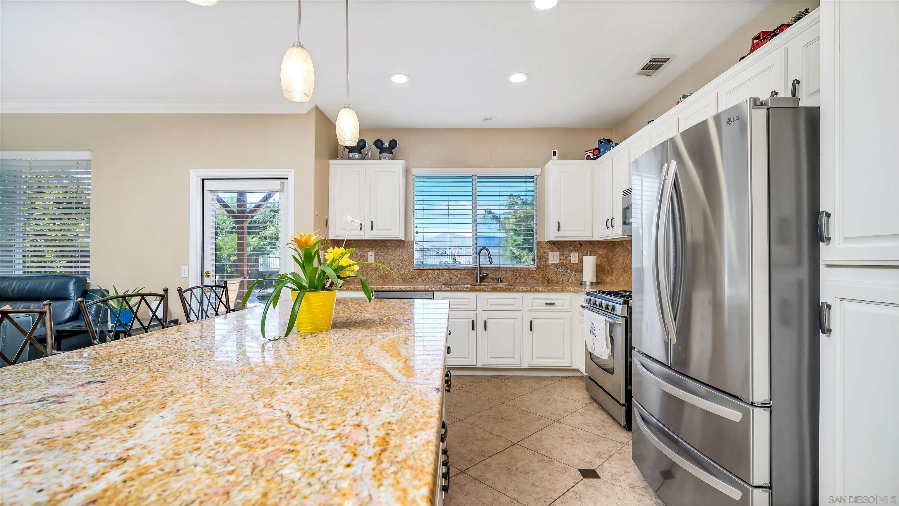 16163 Setting Sun Circle Riverside, CA 92503 - Photo 9 of 45 a kitchen with stainless steel appliances granite countertop a refrigerator and a sink