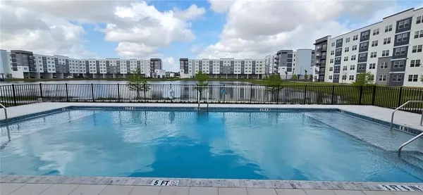a view of swimming pool from a balcony