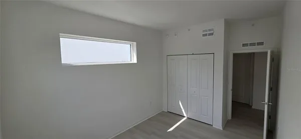 a bathroom with a tub shower sink vanity and a toilet