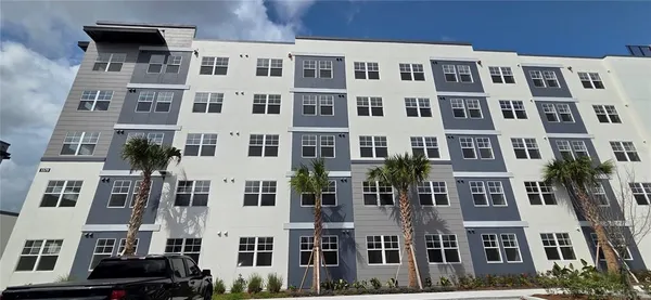 a view of a brick building with many windows