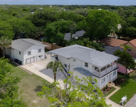 an aerial view of a house with a garden
