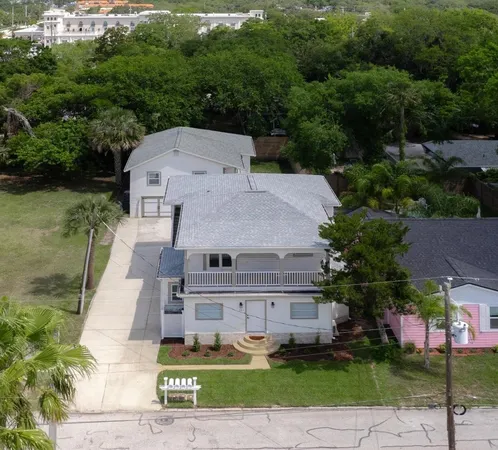 an aerial view of a house with a garden