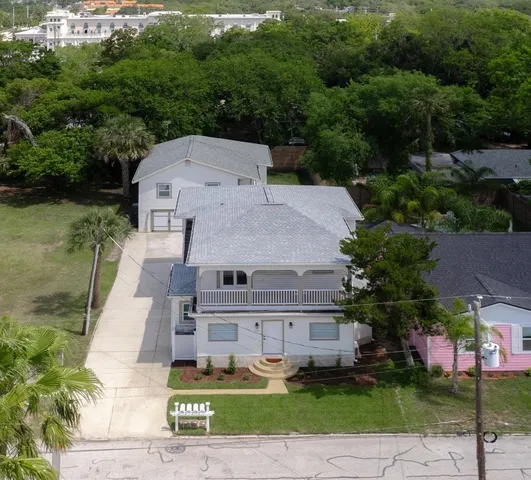 an aerial view of a house with a garden