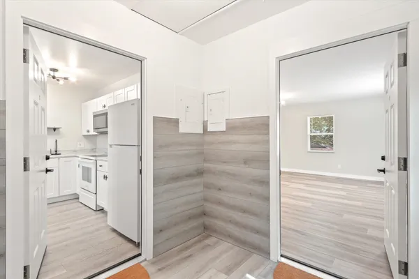 a bathroom with a shower and closet
