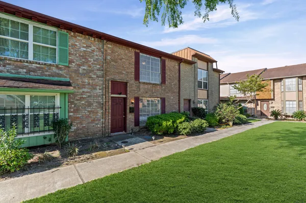 a brick house with a large windows