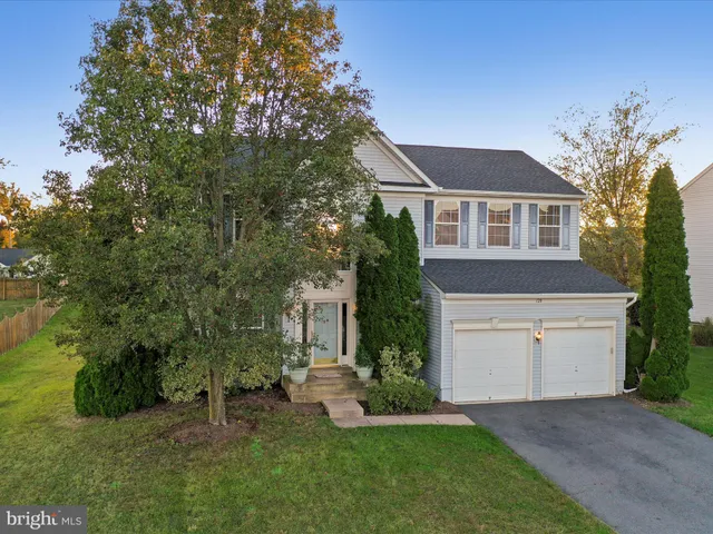 a view of a chandelier fan and entryway