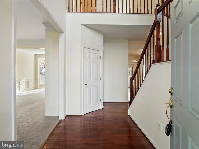 a kitchen with stainless steel appliances granite countertop a stove a refrigerator and a dining table