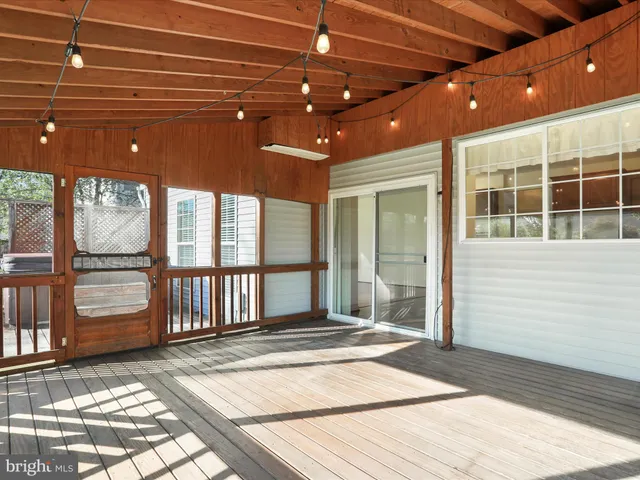 a hallway with a sink and a mirror
