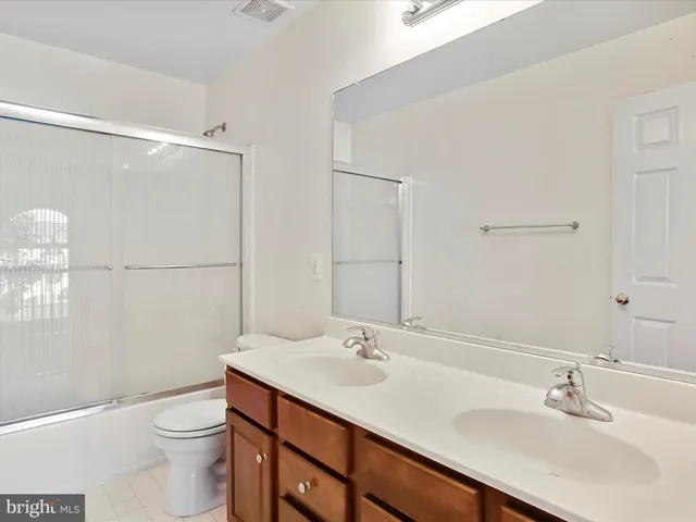a view of an empty room with a cabinet