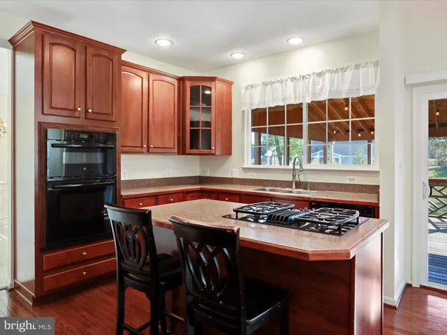 a view of balcony with wooden floor