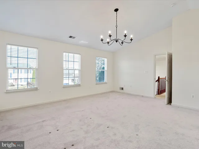 a house with swimming pool in front of it