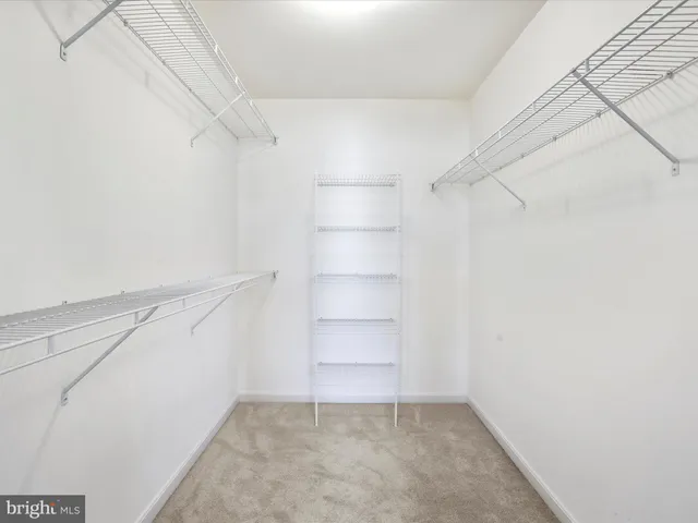 a view of house with a yard and balcony