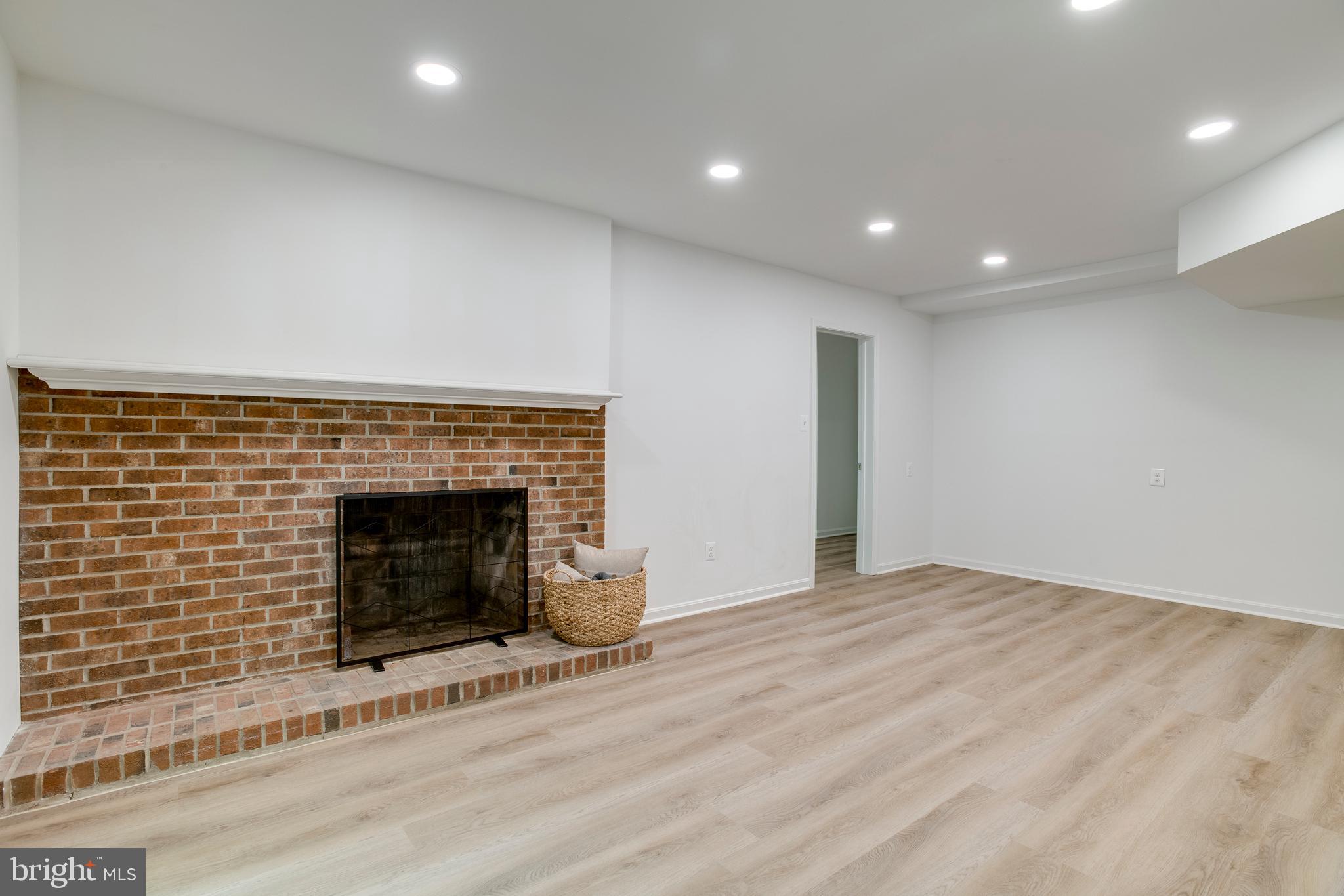 11740 Stuart Mill Road Oakton, VA 22124 - Photo 52 of 67 Rec Room Fireplace