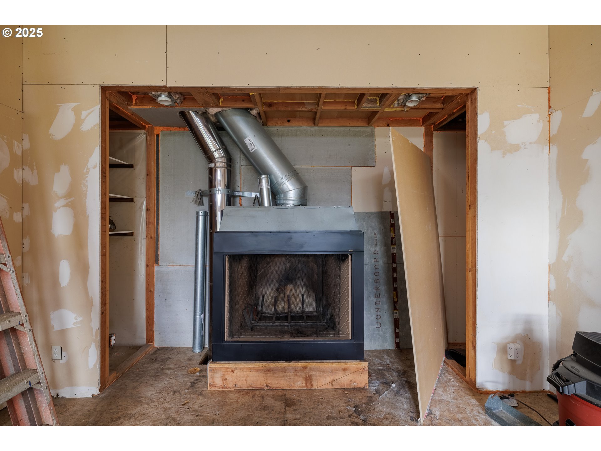 2770 Agate Street Eugene, OR 97403 - Photo 15 of 42 a view of fireplace and utility room
