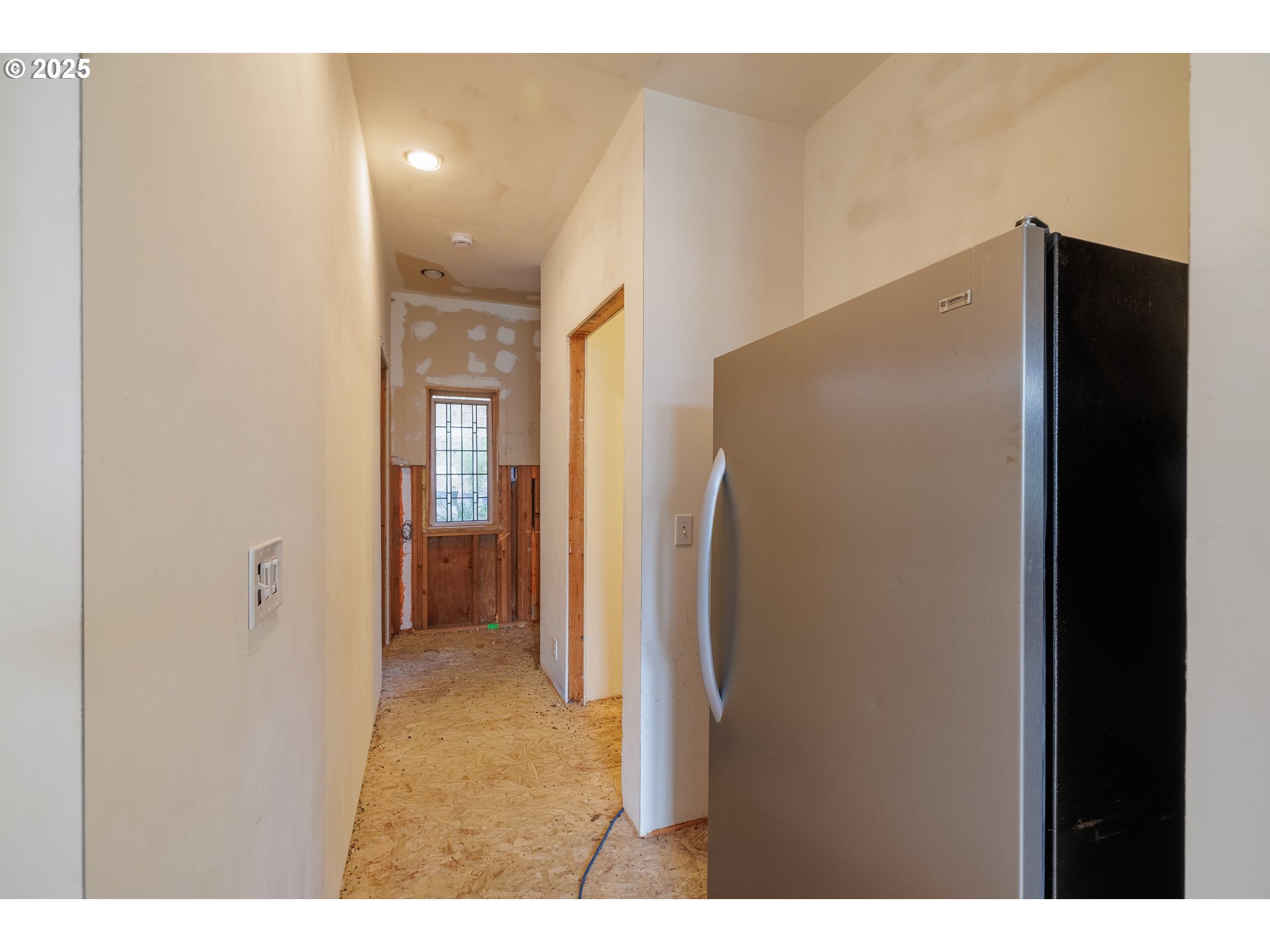 2770 Agate Street Eugene, OR 97403 - Photo 24 of 42 a view of a hallway with wooden shelves