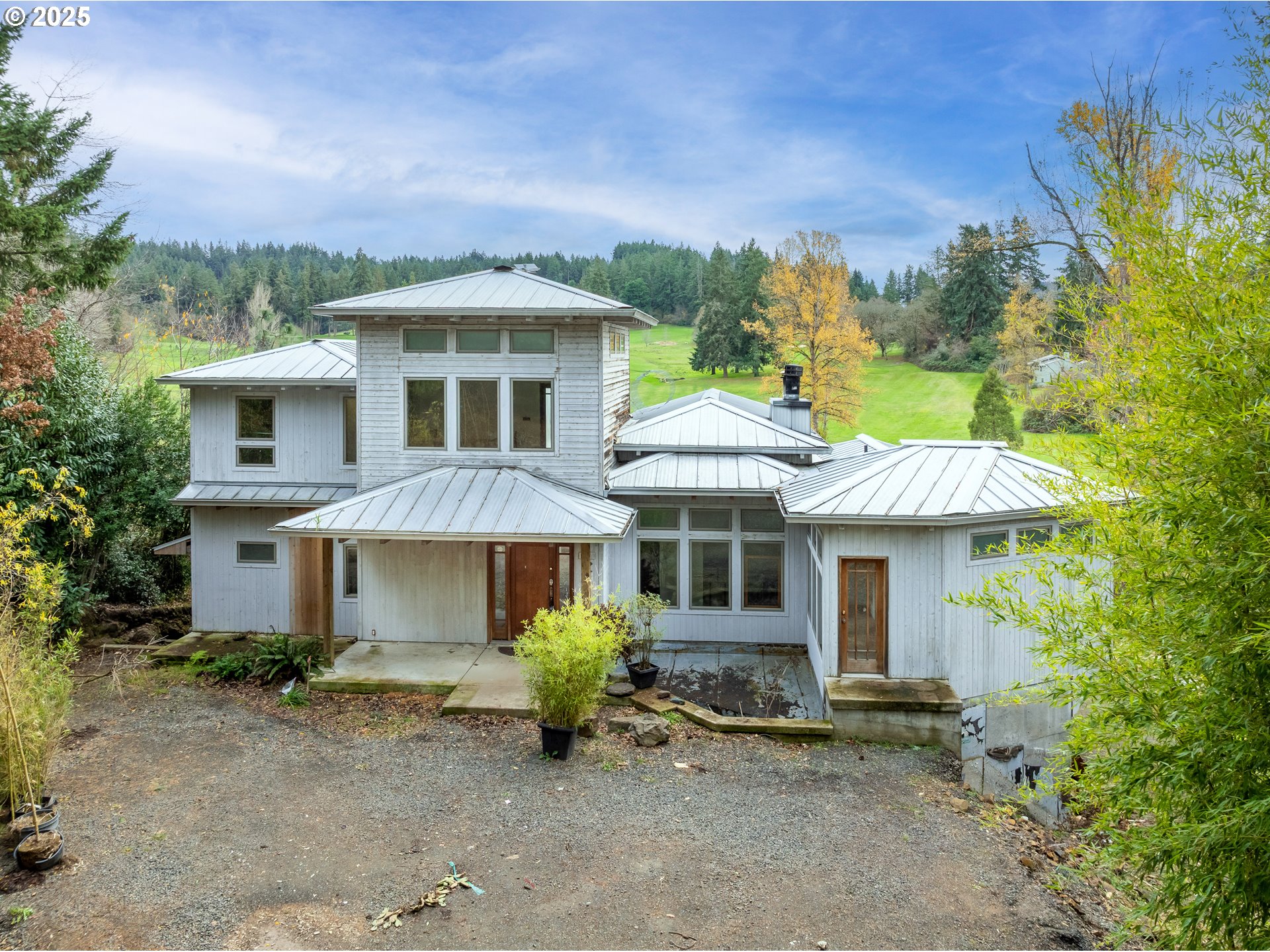 2770 Agate Street Eugene, OR 97403 - Photo 4 of 42 a front view of a house with a garden