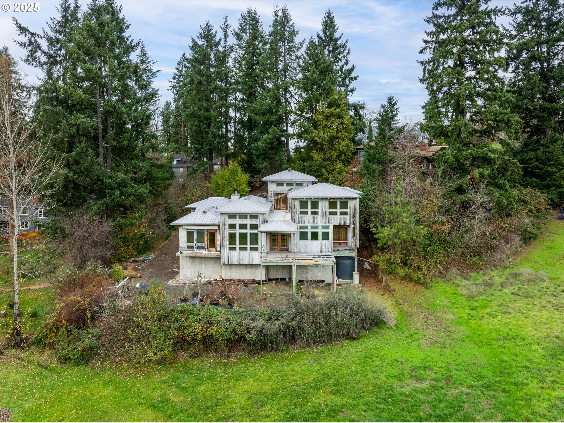 2770 Agate Street Eugene, OR 97403 - Photo 6 of 42 a aerial view of a house with yard and trees in the background