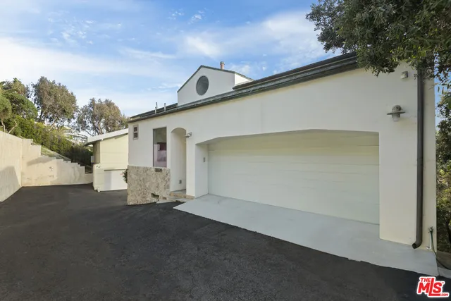 front view of a house with a street
