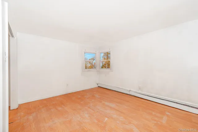 a view of a big room with a window