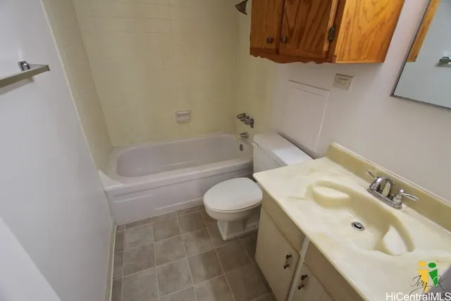 a bathroom with a sink a toilet and bathtub
