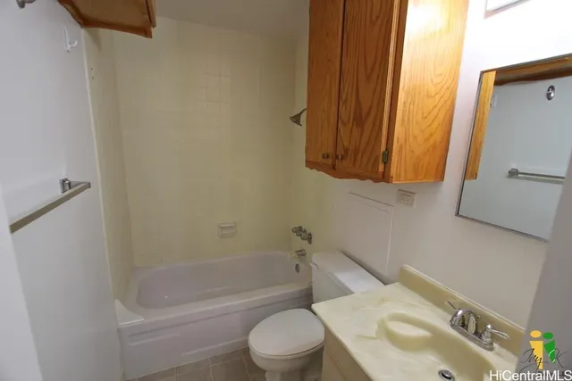 a bathroom with a sink a toilet and bathtub