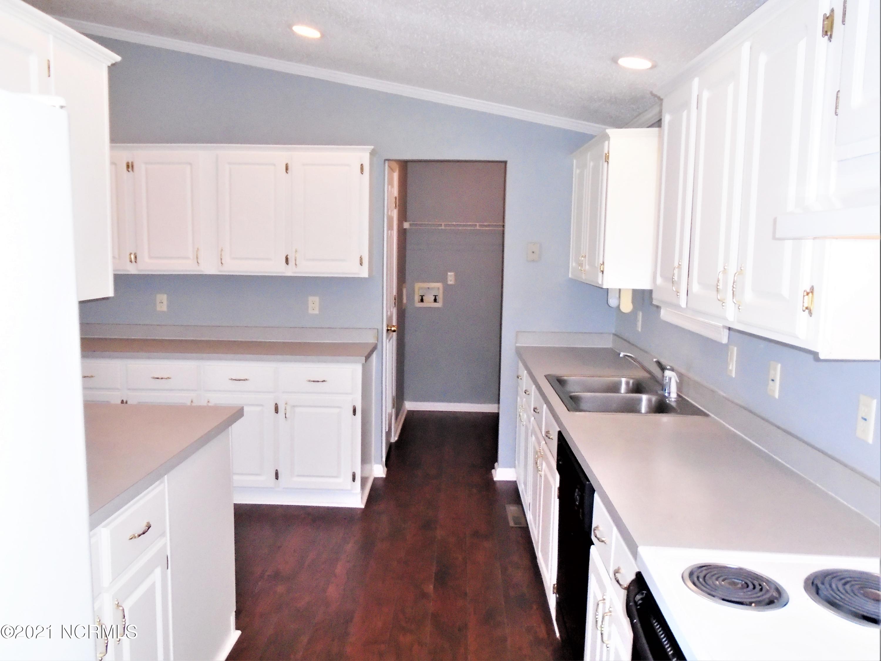 2889 Spring Haven Road Rocky Mount, NC 27804 - Photo 11 of 26 Kitchen towards the mud room/ laundry room at back door entry