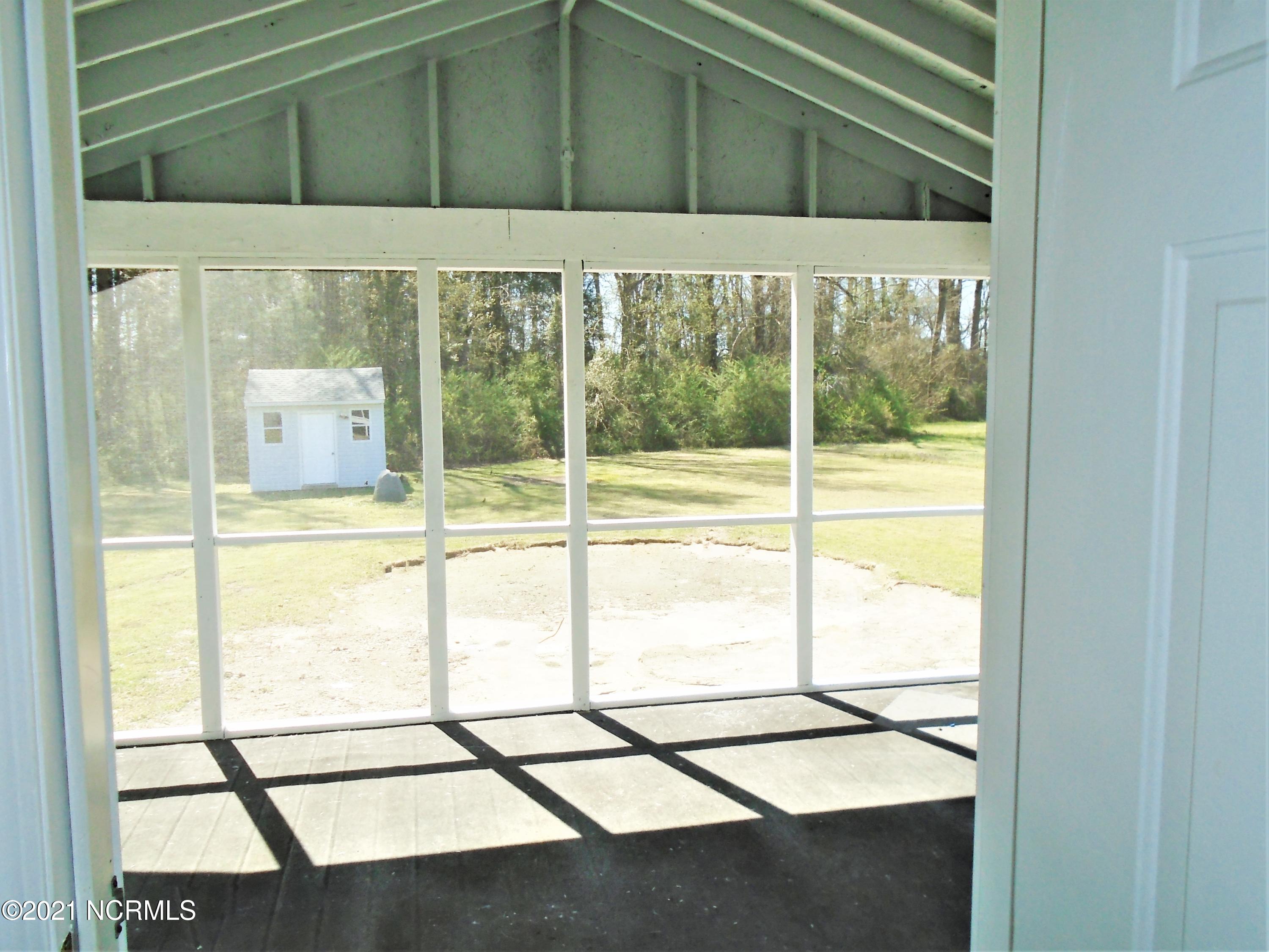 2889 Spring Haven Road Rocky Mount, NC 27804 - Photo 12 of 26 Out the laundry room doorway is a screened porch