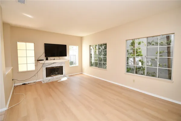 a view of a livingroom with a flat screen tv and a fireplace