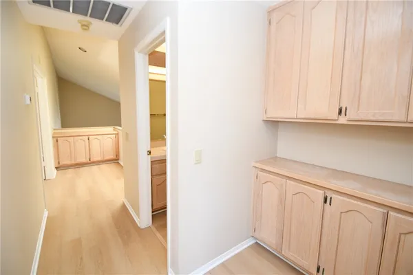 a view of an entryway with wooden floor